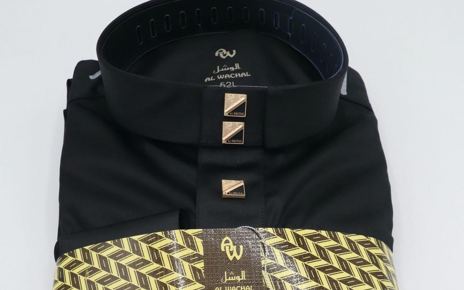 Custom snap buttons in gold and gunmetal on a black shirt