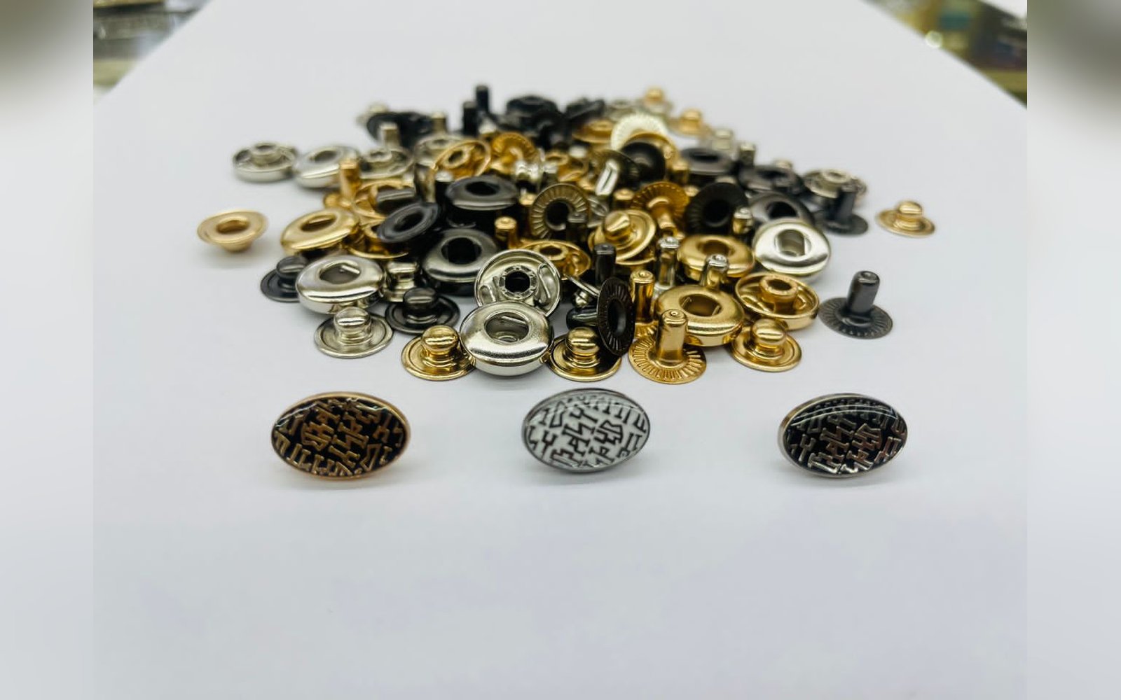 Custom metal snap buttons in gold, silver and gunmetal finishes